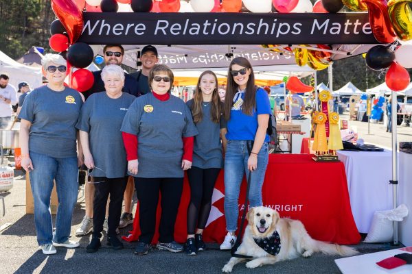group of people and a dog outdoor at a Byars Wright event